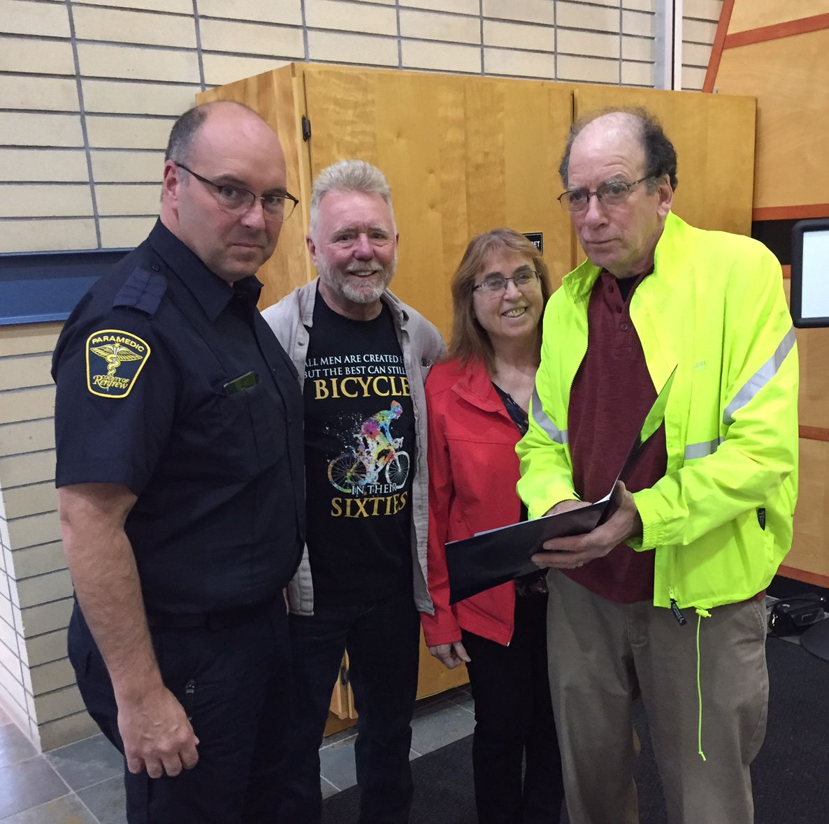 County of Renfrew Emergency Services director Mike Nolan and OVCATA activists Chris Hinsperger, Kathy Eisner, and Ish Theilheimer go over plans for Active Transportation Month.