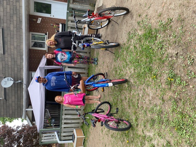 In Pembroke, Tina Panke and family receiving bikes from Bike Bank on May 20.