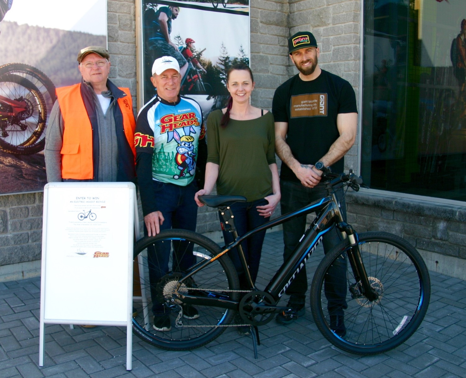 Gearheads gives OVCATA a big boost with donation of a Specialized e-bike for a fund-raising raffle. From left: OVCATA Board members Eric Price and Ron Moss and Gearheads owners Margo Johnson, Mark Johnson.