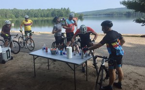 <b>Riders stop to refresh and recharge at the Wadsworth Lake water station at the first-ever Tour de BeaverTails</b>